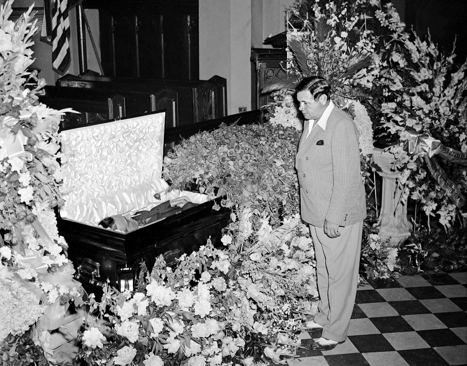 A solemn Babe Ruth views body of Lou Gehrig at Christ Church